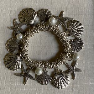 Stretchy silver shell and pearl bracelet